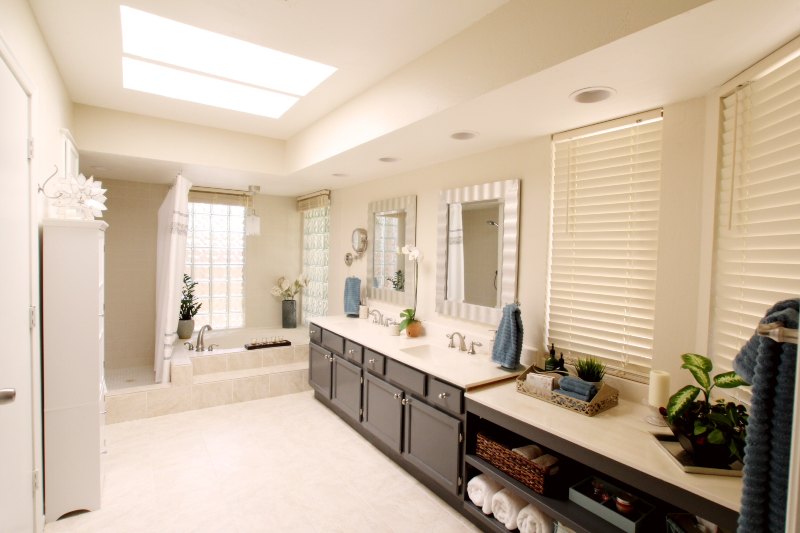 bathroom remodel white floors and walls with brown cabinets in Scottsdale